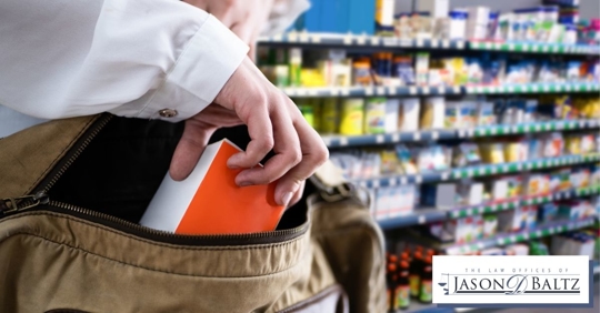 Person stealing medicine from a pharmacy
